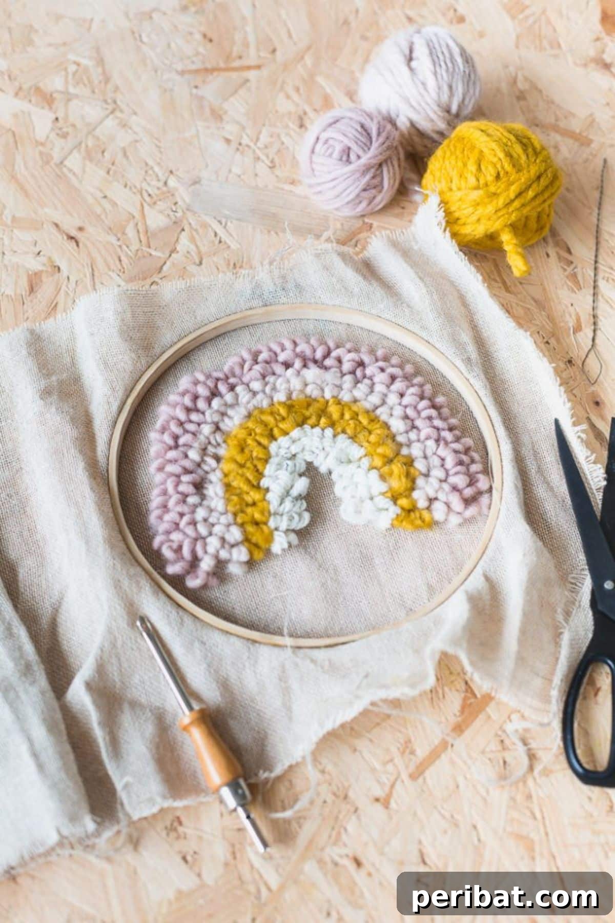 A colorful DIY rainbow punch needle kit for a fun and quick project.