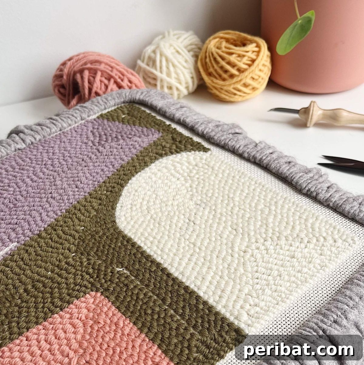 Detailed guide on selecting the right materials for a DIY punch needle rug.