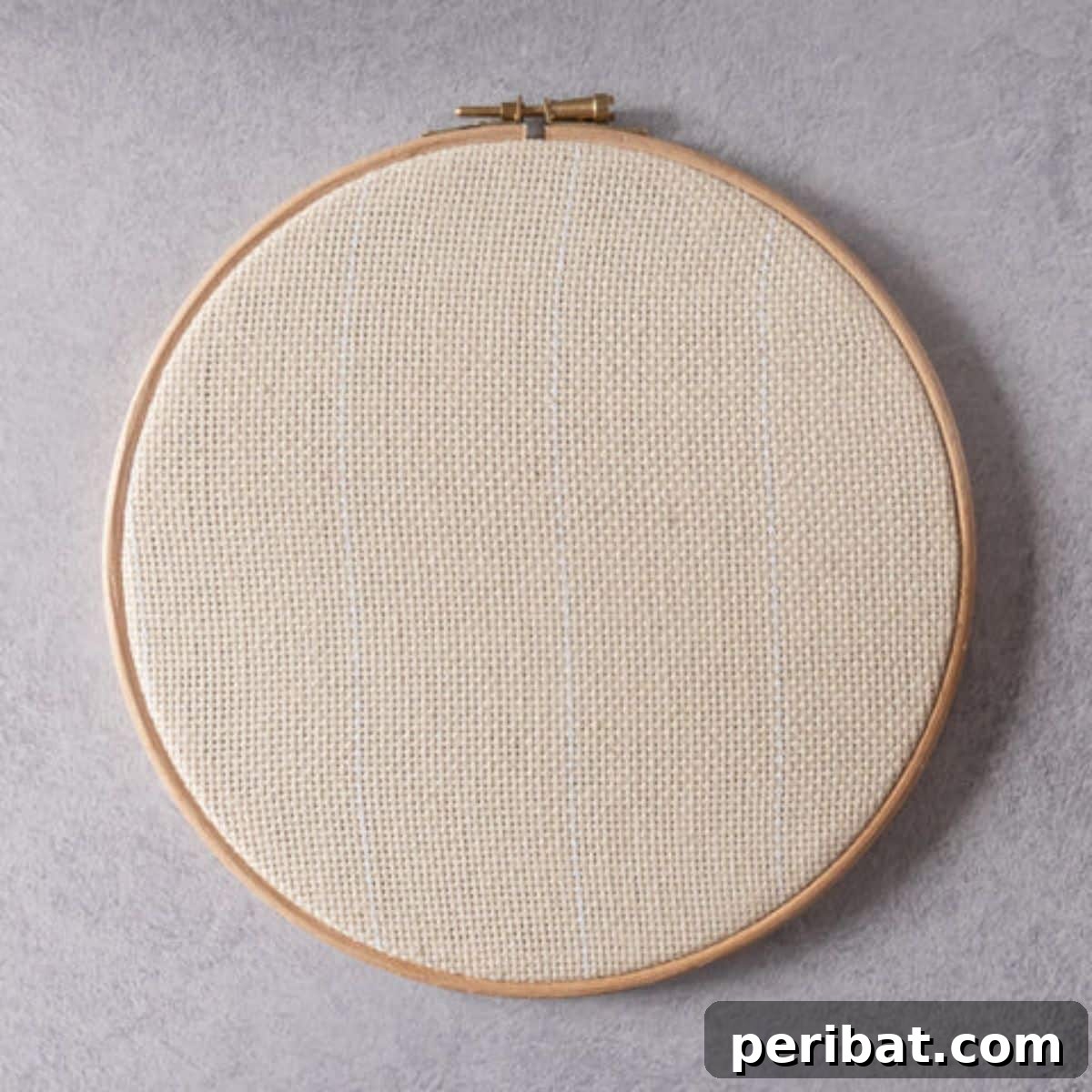 Step-by-step punch needle tutorial on preparing your fabric hoop for optimal punching.