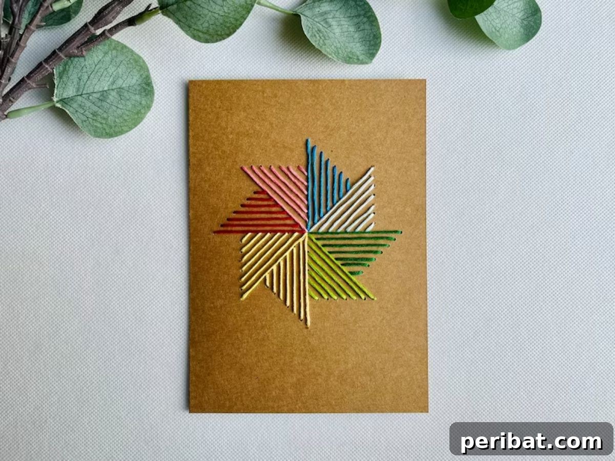 Elegant Pinwheel Hand-Stitched Greeting Card Kit, featuring pre-punched holes and colorful threads for embroidery