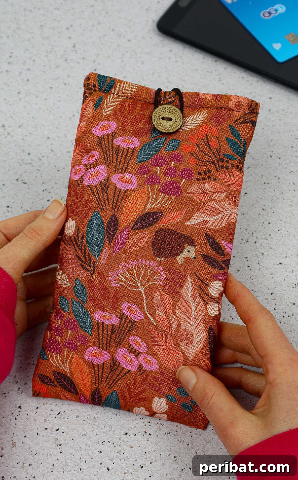 Your Phone Your Canvas 45 DIY Case Crafts 12 A luxurious phone case crafted from velvet fabric, offering a soft and protective pouch-style design for carrying the device.