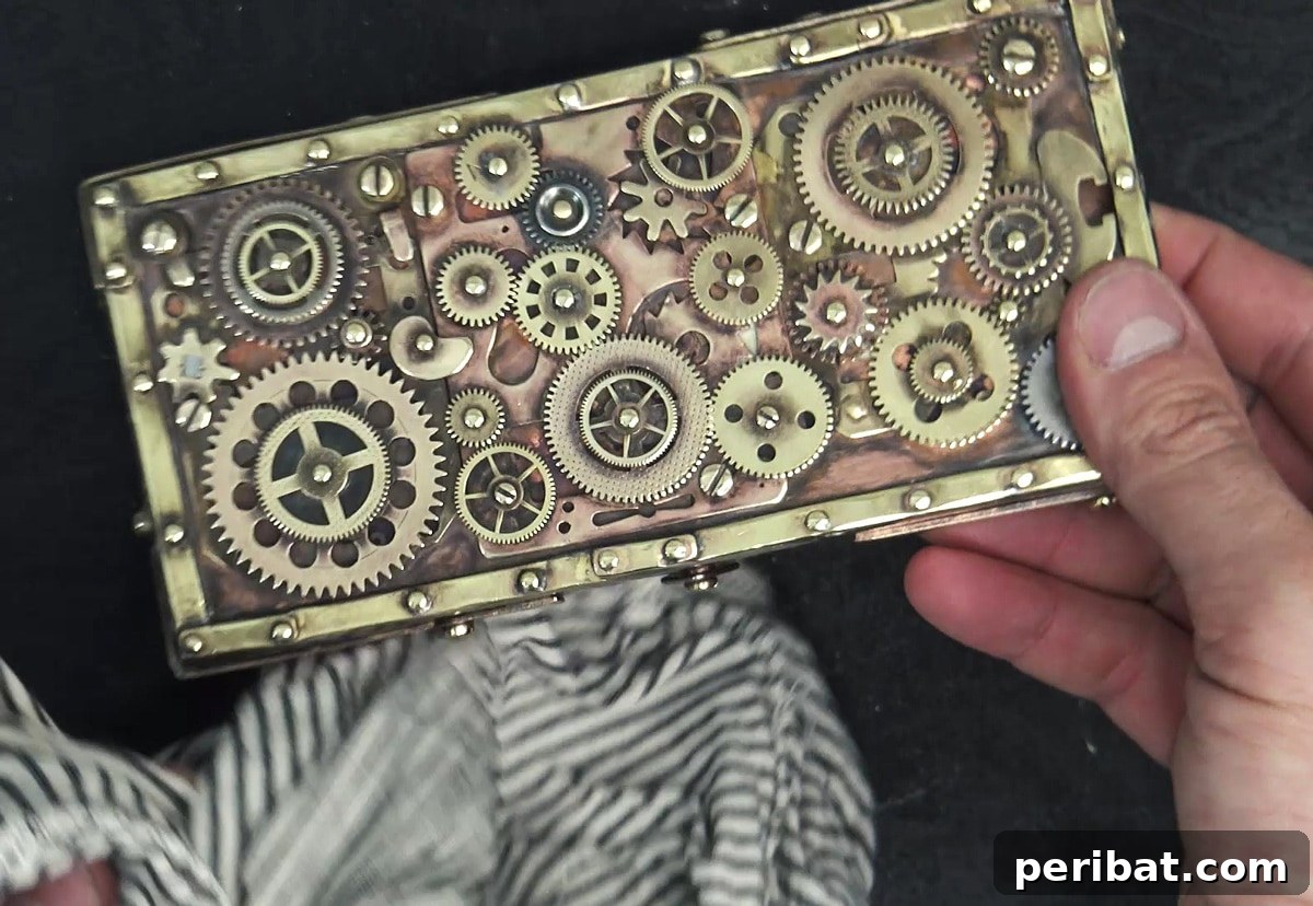 Your Phone Your Canvas 45 DIY Case Crafts 19 An intricately designed steampunk phone case, featuring gears, cogs, and metallic elements reminiscent of Victorian industrial aesthetics.