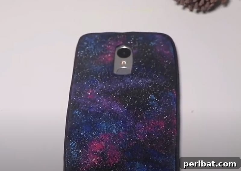 Your Phone Your Canvas 45 DIY Case Crafts 20 A simple yet elegant phone case, showcasing a subtle galaxy aesthetic crafted from foam, with hints of cosmic colors.