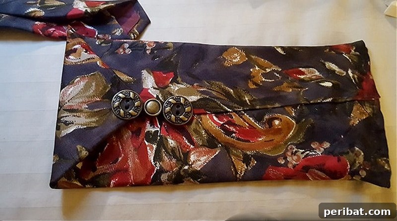 Your Phone Your Canvas 45 DIY Case Crafts 22 A unique cell phone case ingeniously crafted from an old necktie, showcasing creative repurposing and a touch of vintage charm.