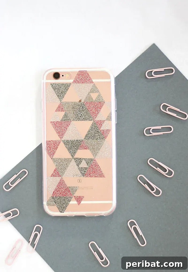Your Phone Your Canvas 45 DIY Case Crafts 28 An array of super simple DIY glitter phone cases, shimmering brightly, surrounded by scattered paper clips, emphasizing their dazzling appeal.