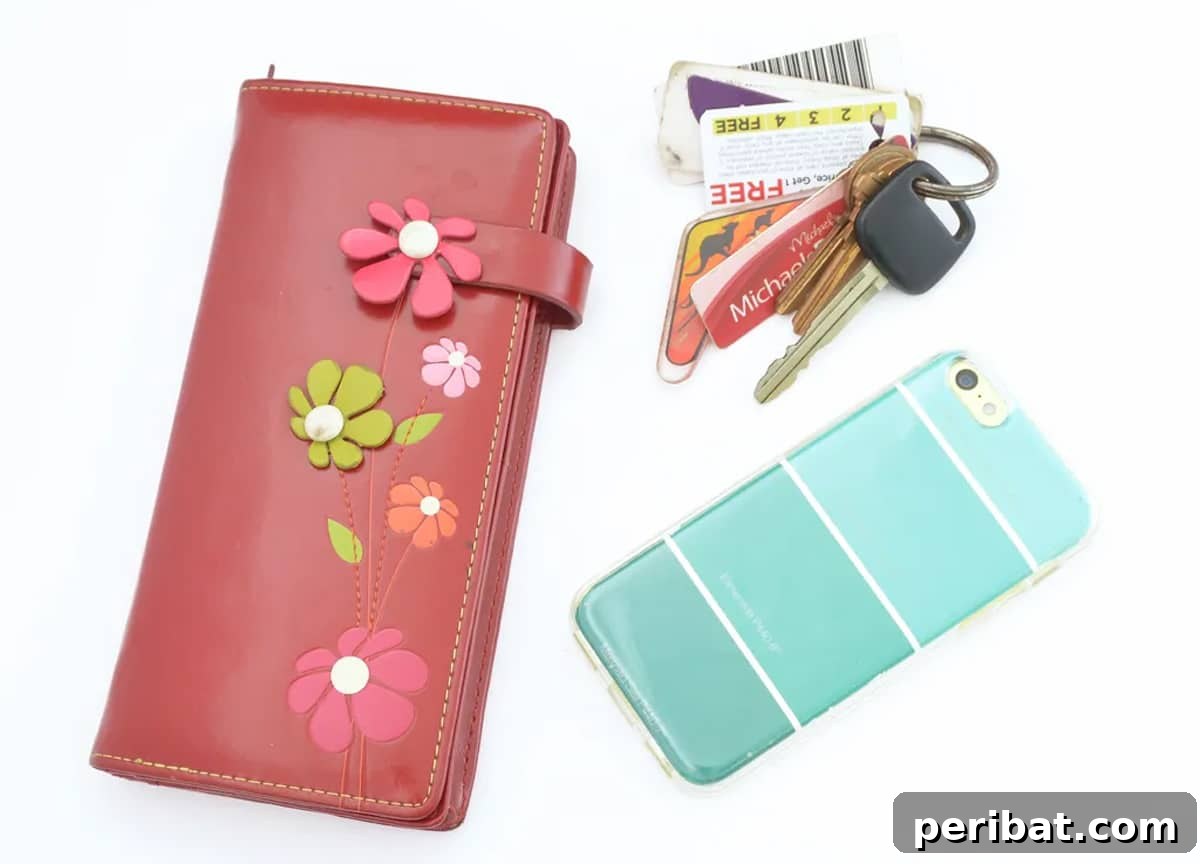 Your Phone Your Canvas 45 DIY Case Crafts 29 A vibrant paint chip phone case, featuring a mosaic of colorful paint swatches, alongside a matching keychain and wallet for a coordinated look.