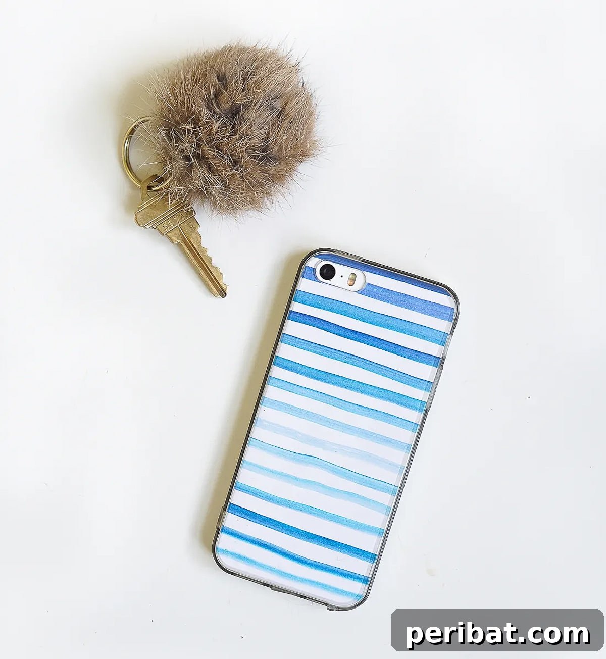 Your Phone Your Canvas 45 DIY Case Crafts 30 A beautifully artistic watercolor phone case, featuring soft, blended hues that create an ethereal and unique design, paired with a simple key.