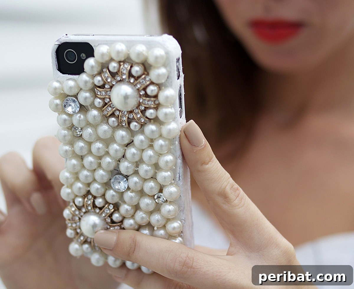 Your Phone Your Canvas 45 DIY Case Crafts 34 An elegant pearl phone case, meticulously adorned with lustrous pearls and sparkling rhinestones, creating a luxurious and sophisticated design.