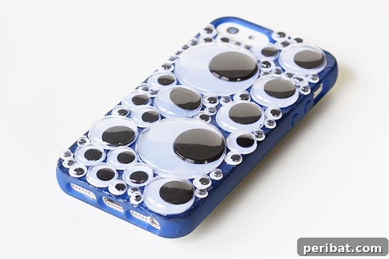 Your Phone Your Canvas 45 DIY Case Crafts 37 A truly unique phone case adorned with an assortment of playful googly eyes, creating a whimsical and wonderfully quirky design.