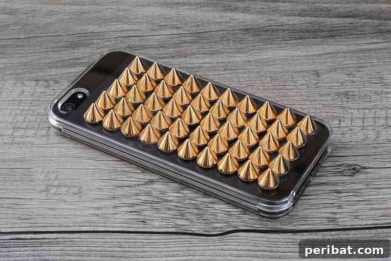 Your Phone Your Canvas 45 DIY Case Crafts 38 An edgy and bold spiked phone case, adorned with metallic studs and sharp spikes, creating a distinct punk-rock inspired aesthetic.