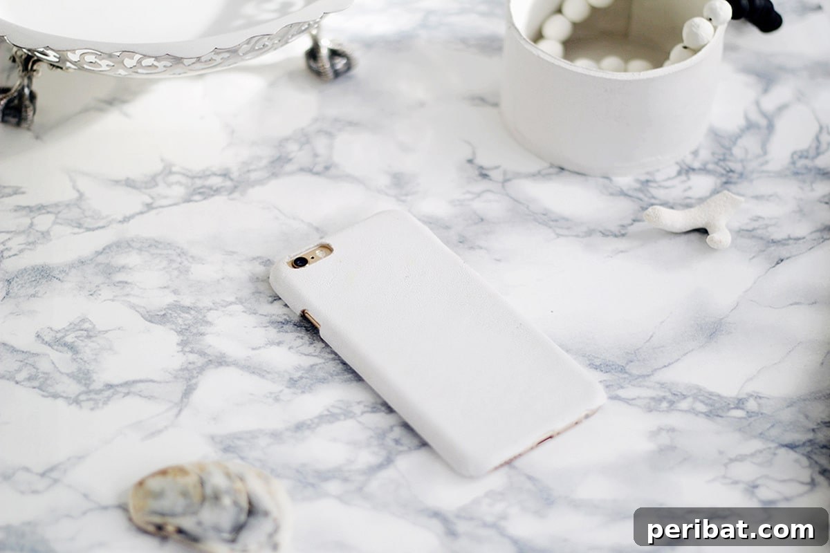 Your Phone Your Canvas 45 DIY Case Crafts 40 A sleek and minimalist white leather phone case, showcasing expert craftsmanship and timeless elegance.
