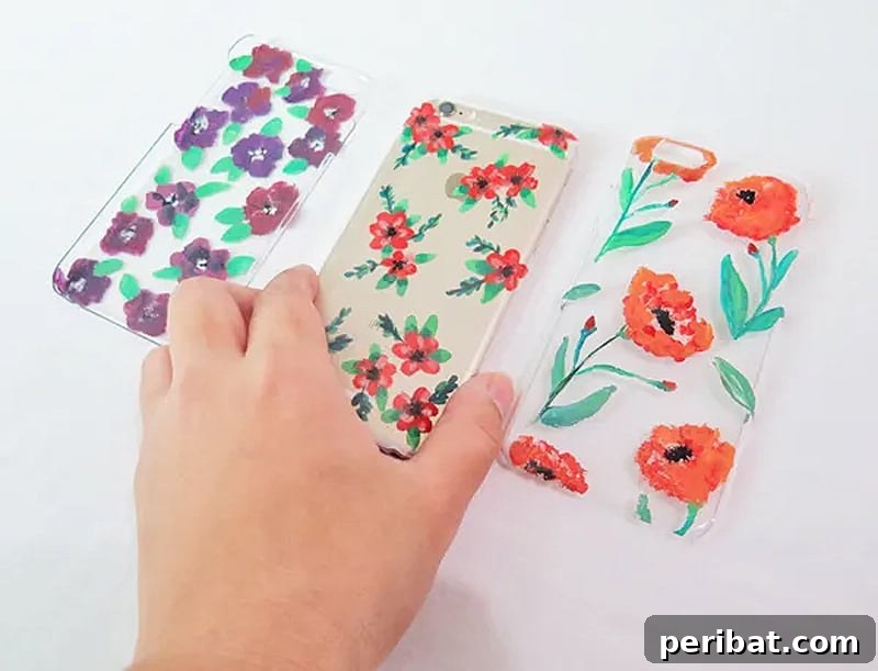 Your Phone Your Canvas 45 DIY Case Crafts 41 Three distinct flower-shaped silicone phone cases, each delicately adorned with watercolor designs, creating soft, artistic, and unique patterns.