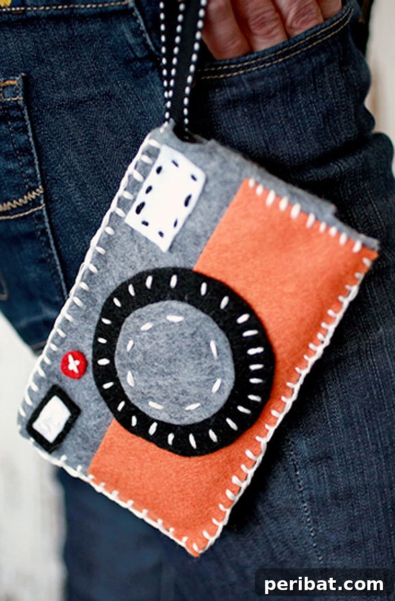 Your Phone Your Canvas 45 DIY Case Crafts 8 A soft and protective felt phone case, adorned with decorative stitches and a button closure, showcasing cozy craftsmanship.