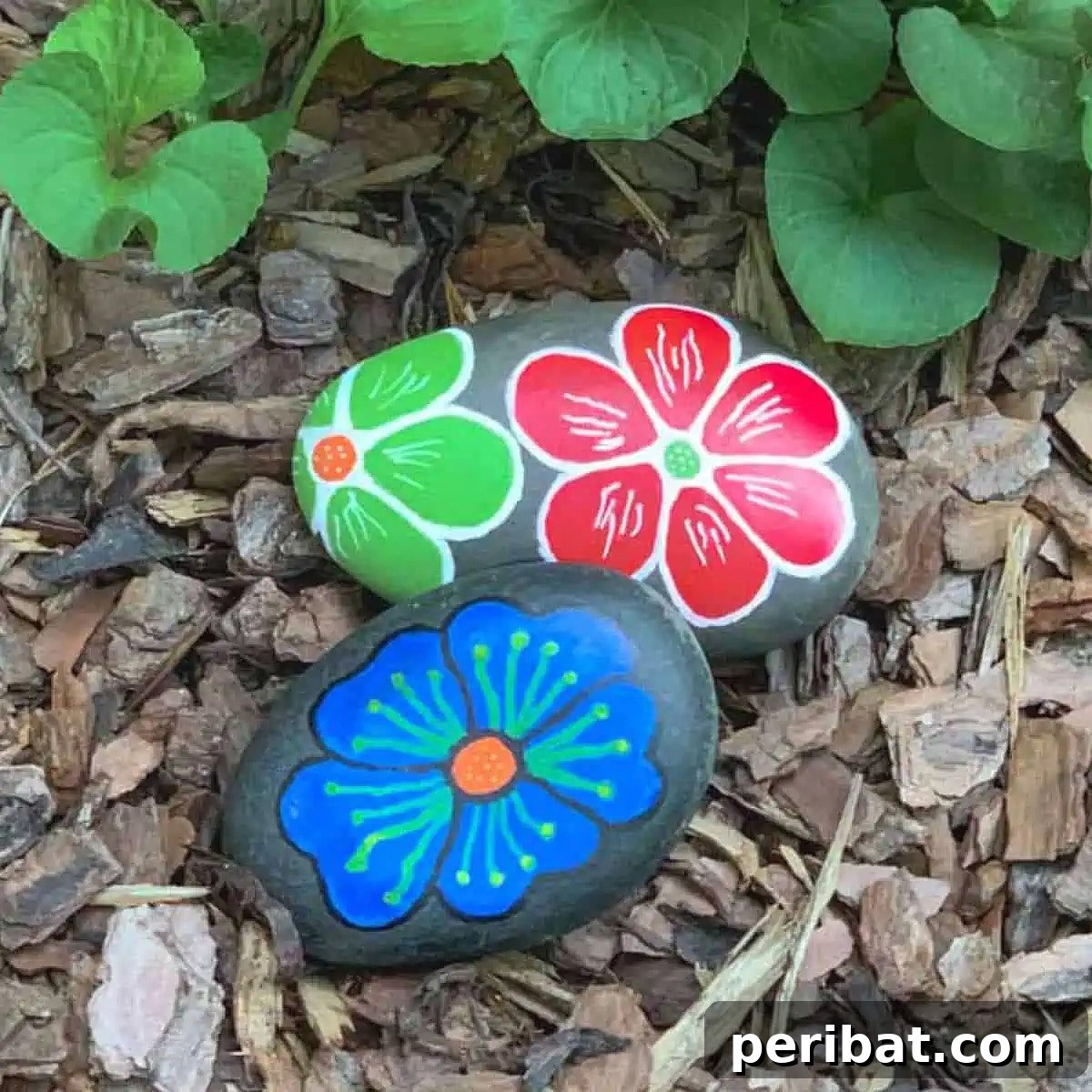 Creative Painted Rocks: Ideas, Projects, and Starter Kits 12 Vibrantly painted rocks with floral designs