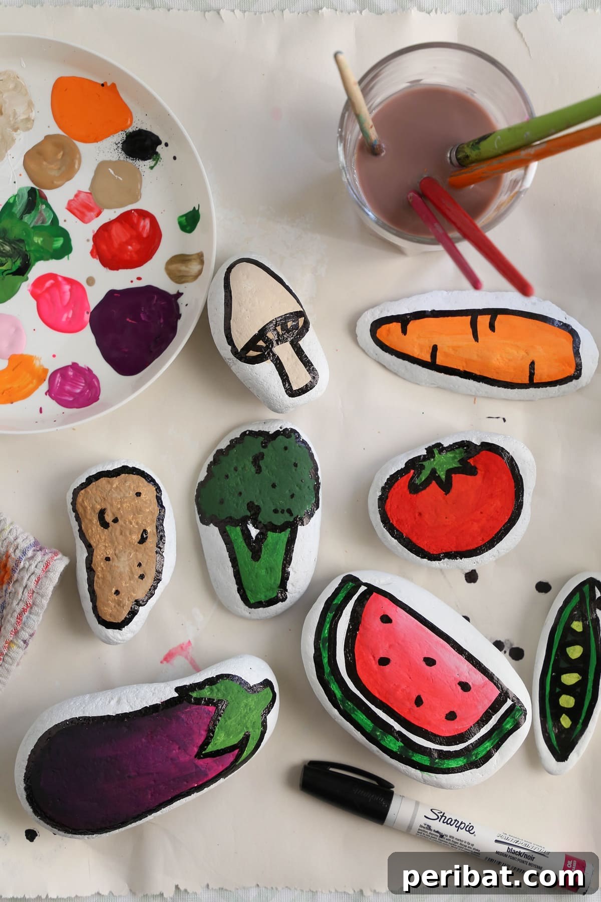 Creative Painted Rocks: Ideas, Projects, and Starter Kits 15 An array of colorful fruit and veggie painted rocks