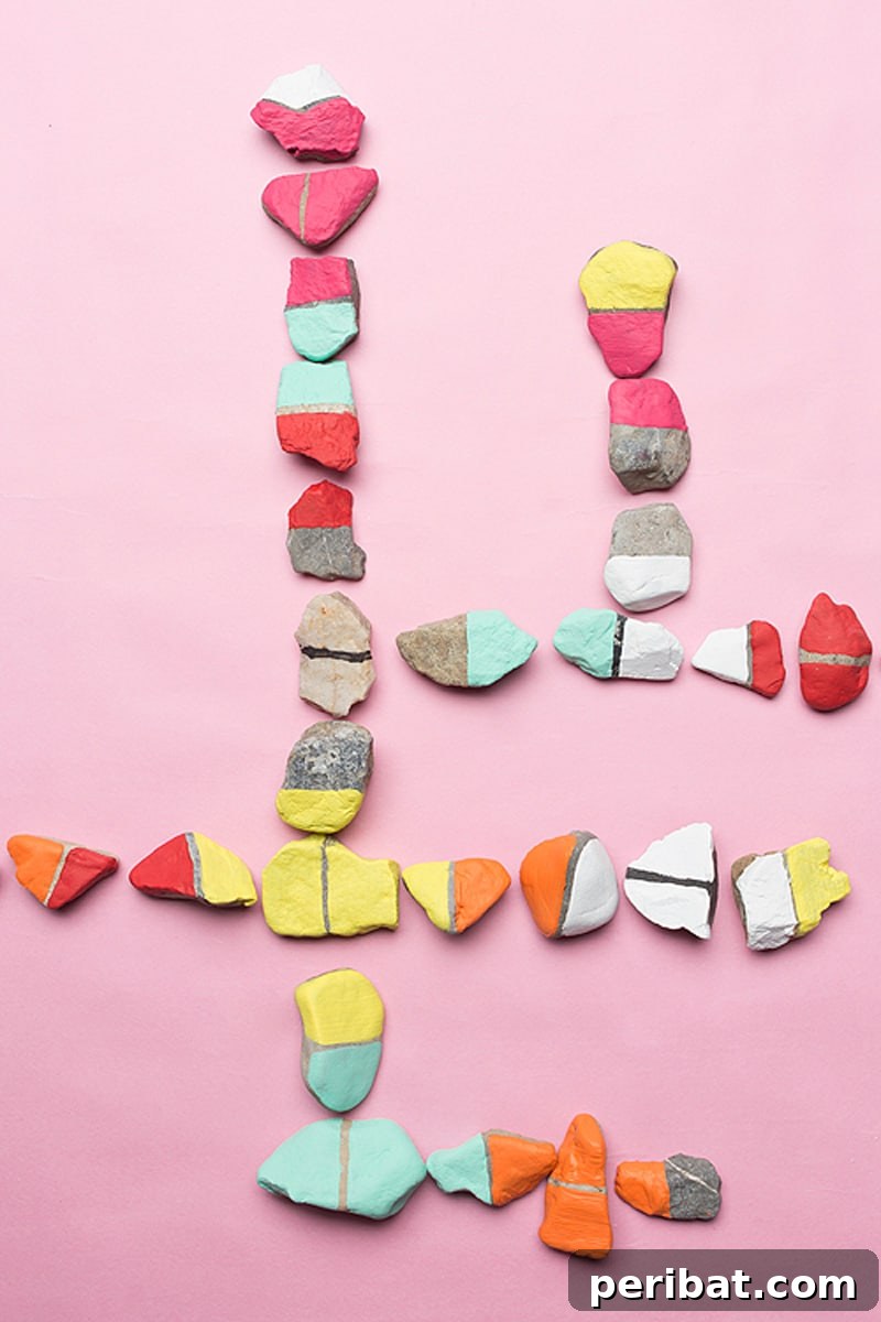 Creative Painted Rocks: Ideas, Projects, and Starter Kits 23 Colorful rock dominoes arranged playfully