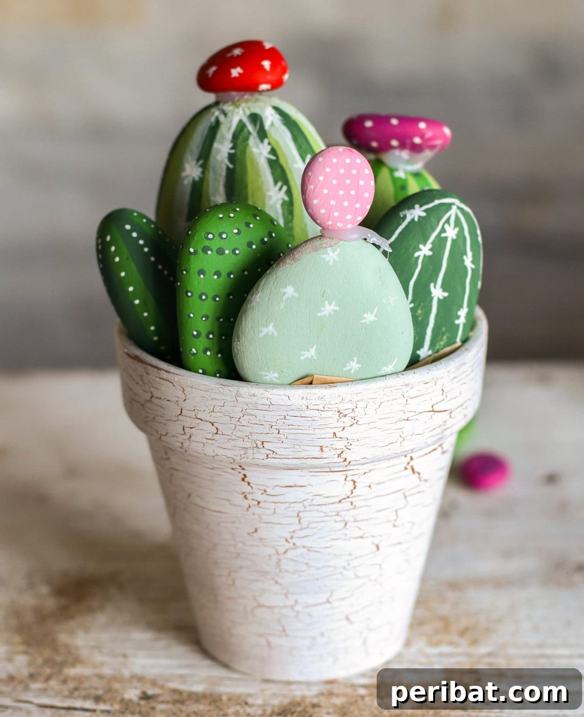 Creative Painted Rocks: Ideas, Projects, and Starter Kits 29 Adorable cactus painted rocks arranged in small pots