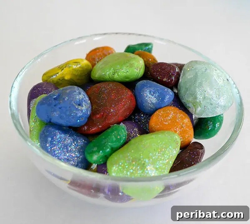 Creative Painted Rocks: Ideas, Projects, and Starter Kits 33 A bowl filled with sparkly painted rocks, resembling jewels
