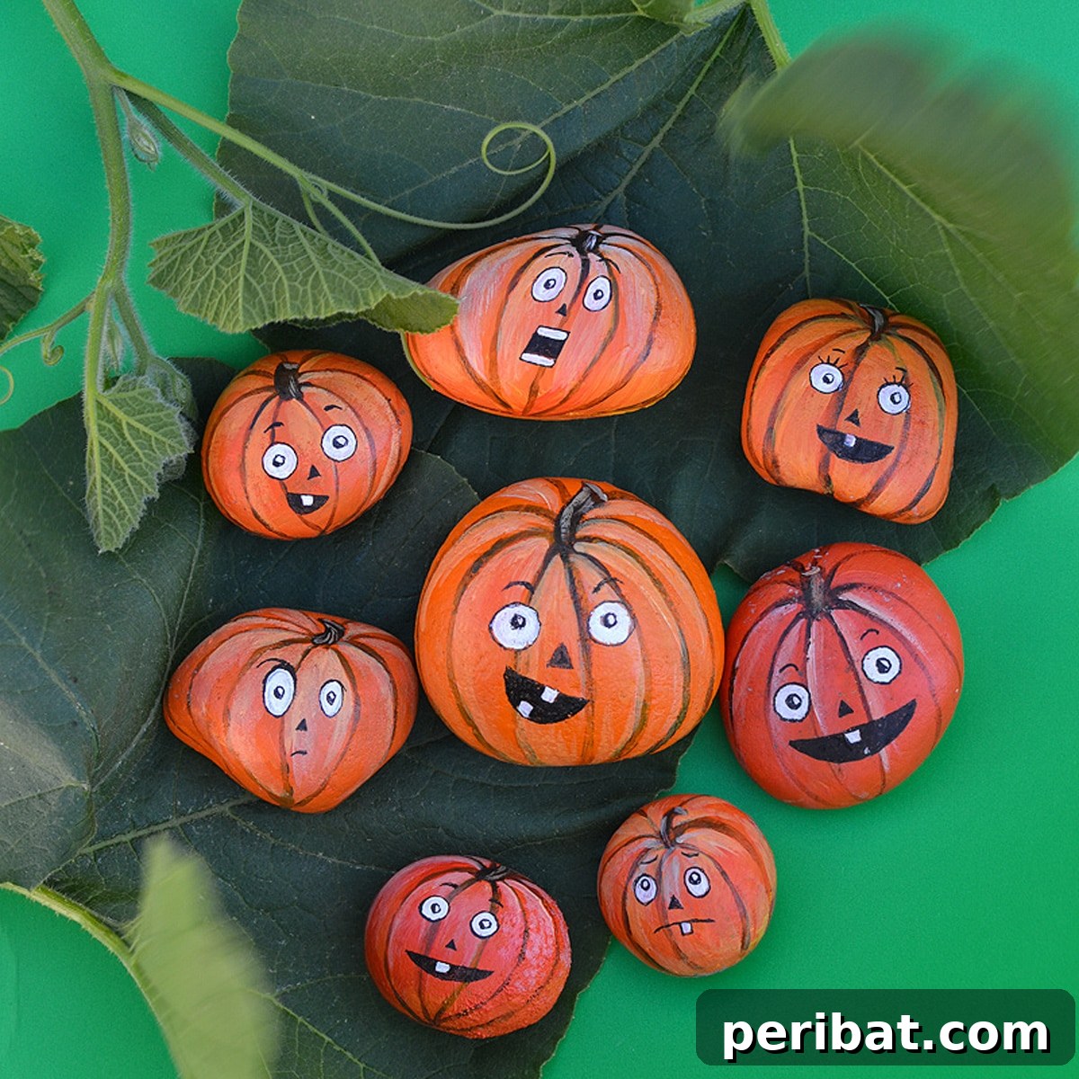 Creative Painted Rocks: Ideas, Projects, and Starter Kits 38 A charming display of various painted pumpkin rocks for Halloween