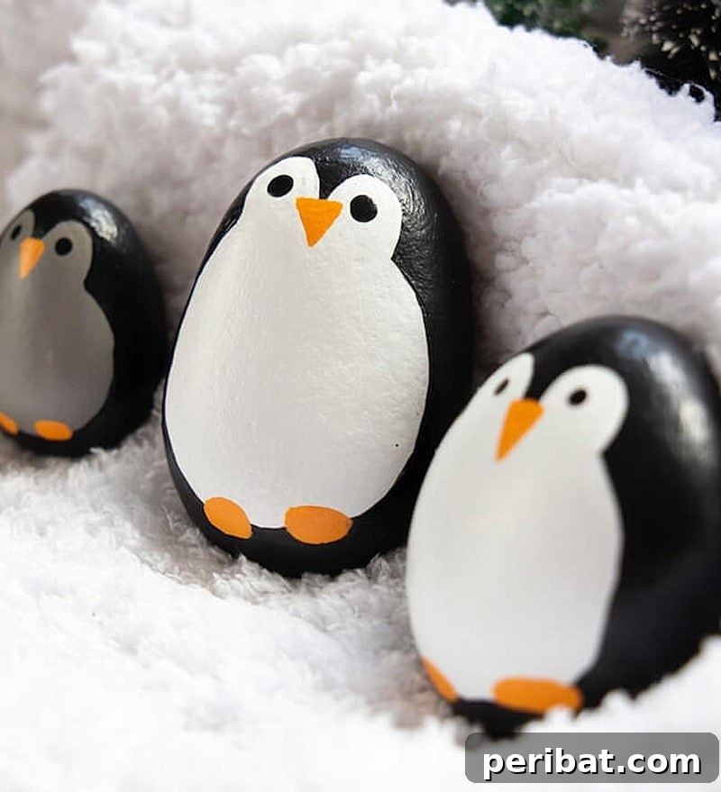Creative Painted Rocks: Ideas, Projects, and Starter Kits 41 Adorable penguin-painted rocks with distinct black and white features
