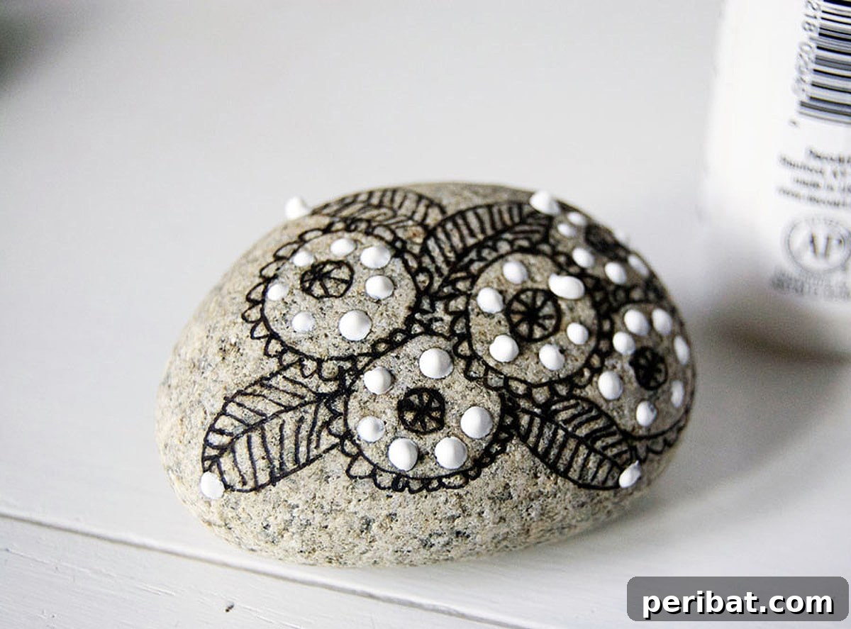 Creative Painted Rocks: Ideas, Projects, and Starter Kits 46 A collection of rocks adorned with intricate doodle art