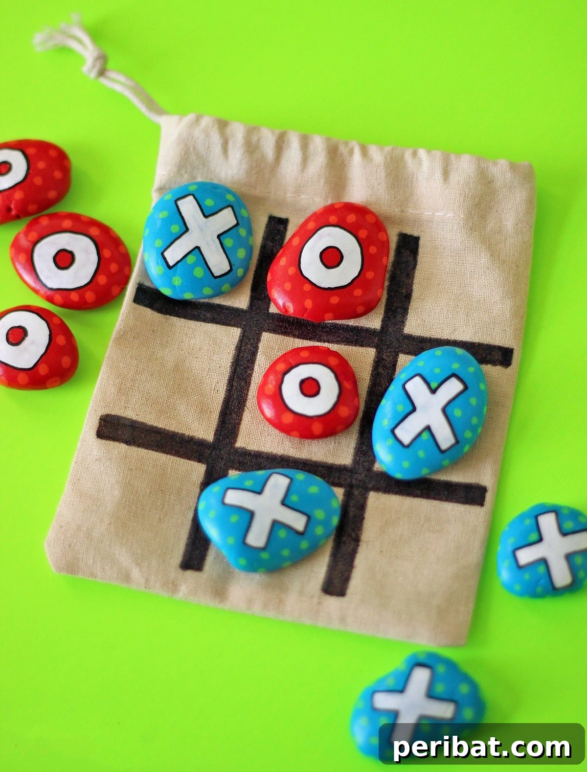 Creative Painted Rocks: Ideas, Projects, and Starter Kits 9 A painted rock tic-tac-toe travel game set with a fabric board