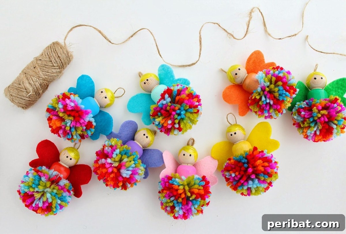 A magical pom pom fairy garland featuring colorful pom poms interspersed with wooden dolls dressed as fairies.