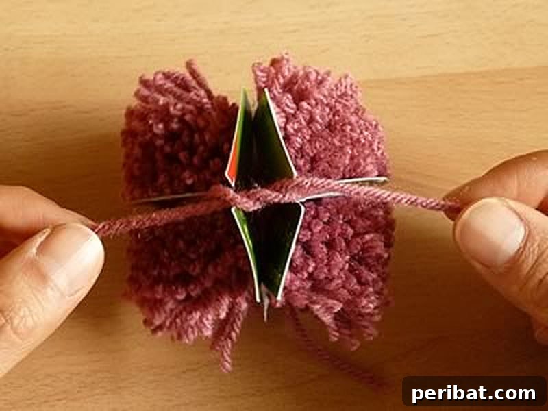 A fast and efficient method to create multiple pom poms quickly using everyday household items.