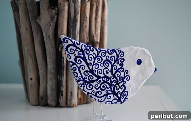 Adorable paper mache bird sculpture, perfect for spring decor