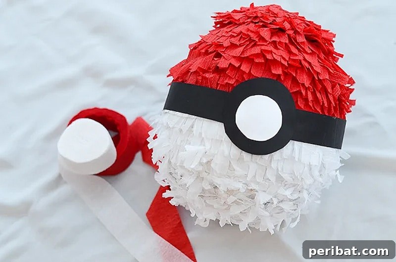 Exciting paper mache Pokeball pinata for themed parties