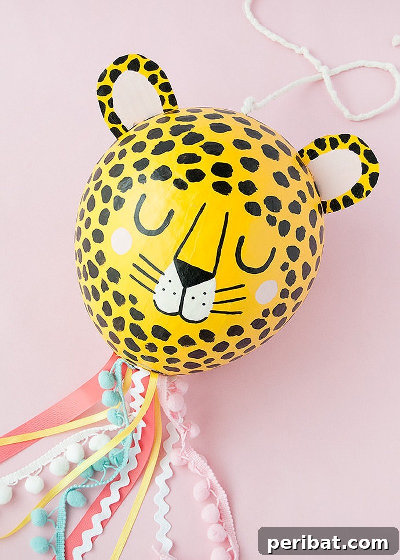 Vibrantly decorated paper mache cheetah piñata, perfect for safari-themed parties
