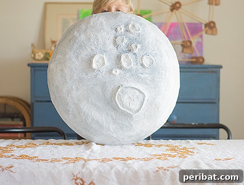 Captivating giant paper mache moon, perfect for ethereal home decor or themed parties