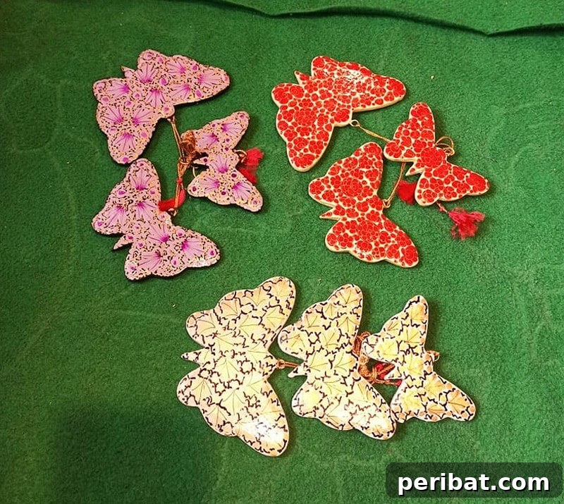 Exquisite handmade paper mache butterfly hanging with intricate designs and vibrant colors