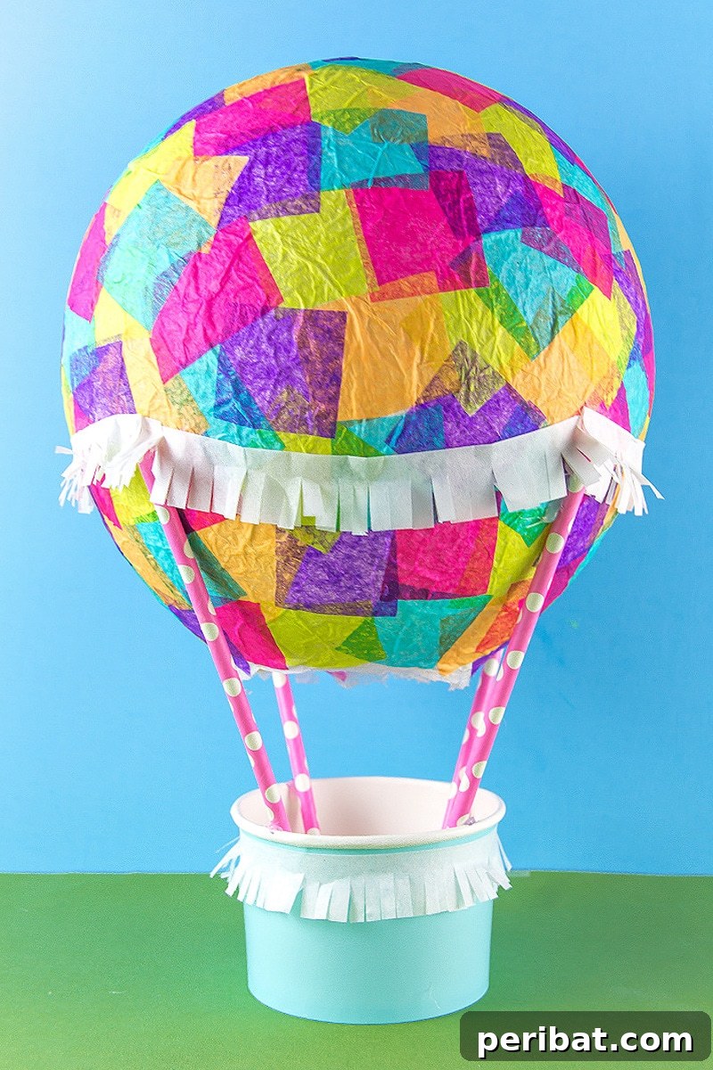 Colorful paper mache hot air balloon made with tissue paper, ideal for kids