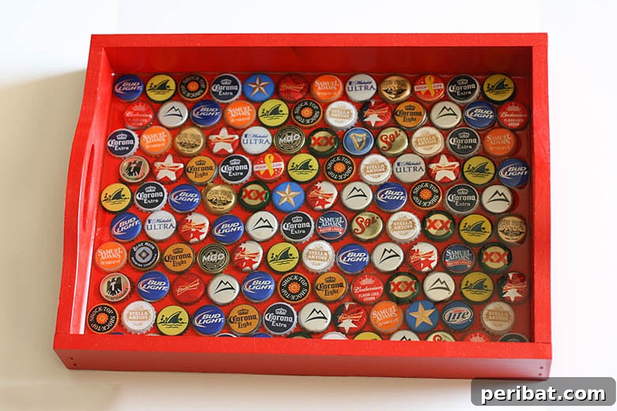 42 Creative DIY Serving Tray Projects 22 Unique DIY bottle cap serving tray with a vibrant mosaic of colorful bottle caps