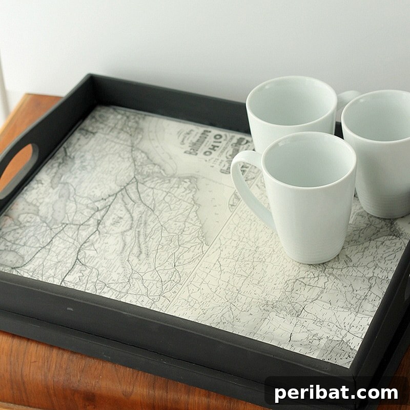42 Creative DIY Serving Tray Projects 27 Nostalgic vintage map serving tray created from a repurposed tray with epoxy seal