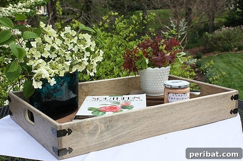 42 Creative DIY Serving Tray Projects 4 Rustic farmhouse style serving tray with decorative metal brackets and wooden handles