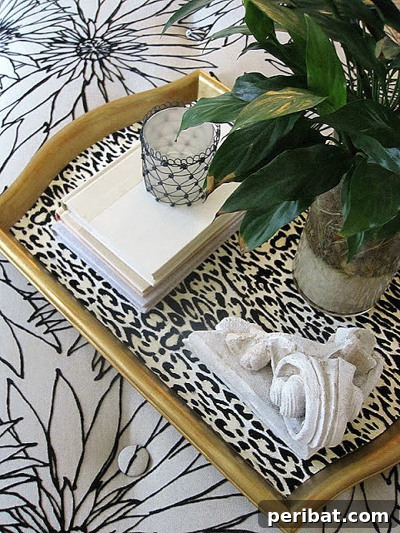 42 Creative DIY Serving Tray Projects 37 Chic DIY leopard print serving tray in black, white, and gold, adding sophisticated glamour