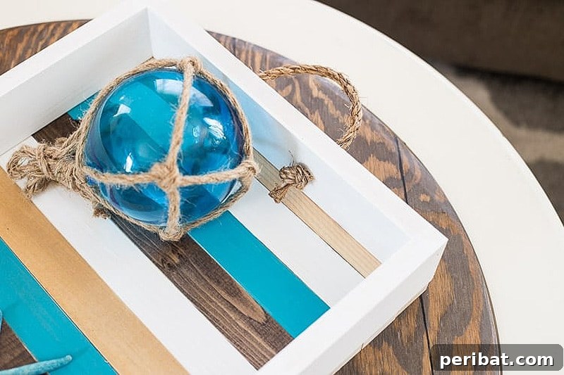 42 Creative DIY Serving Tray Projects 8 Striped DIY coastal serving tray with rope handles and blue orb decor