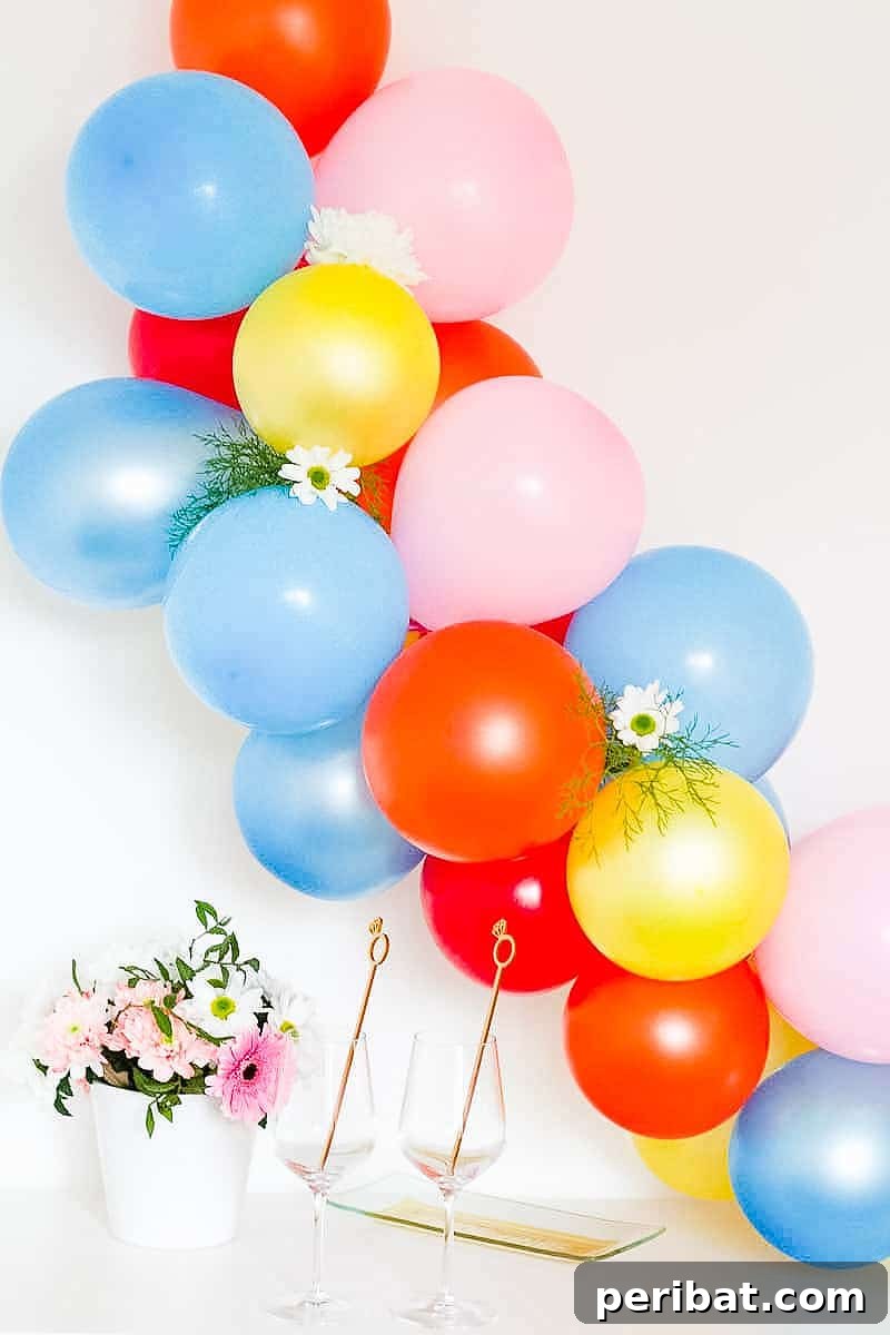 Stunning DIY Balloon Garlands: 27 Ideas & Starter Kits 9 balloon garland with floral touch