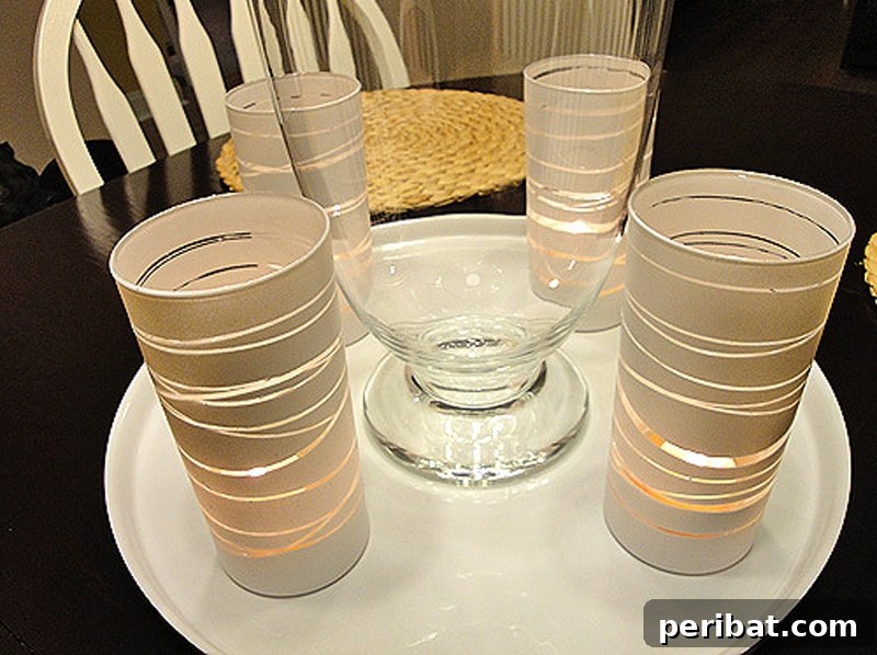 Sophisticated DIY votive candle holders with a rubber band and spray paint design