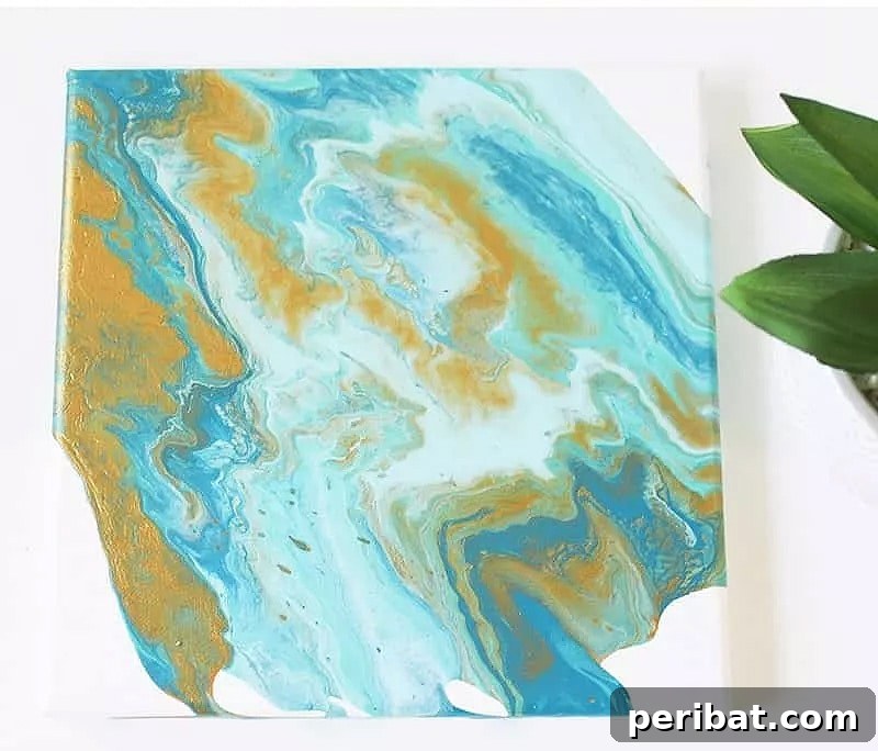 Vibrant DIY turquoise glass centerpiece with bright flowers