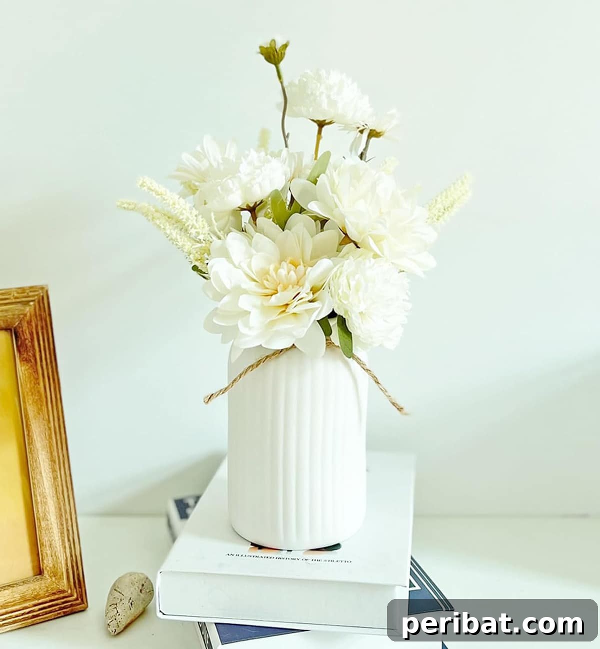 Exquisite bouquet of artificial dahlias in a chic white ceramic vase