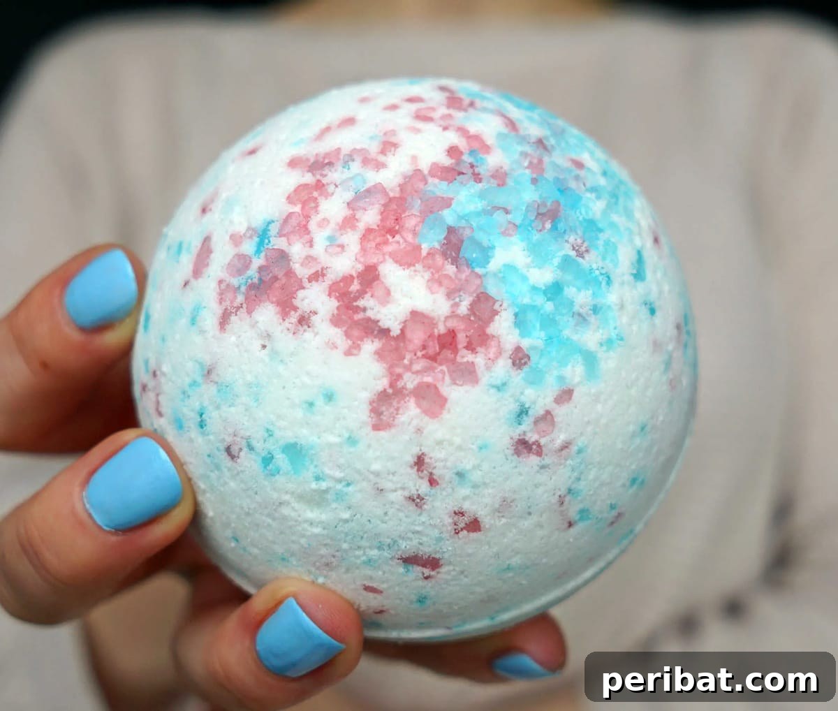 Homemade bath bombs with Epsom salts, beautifully packaged as luxurious DIY party favors.