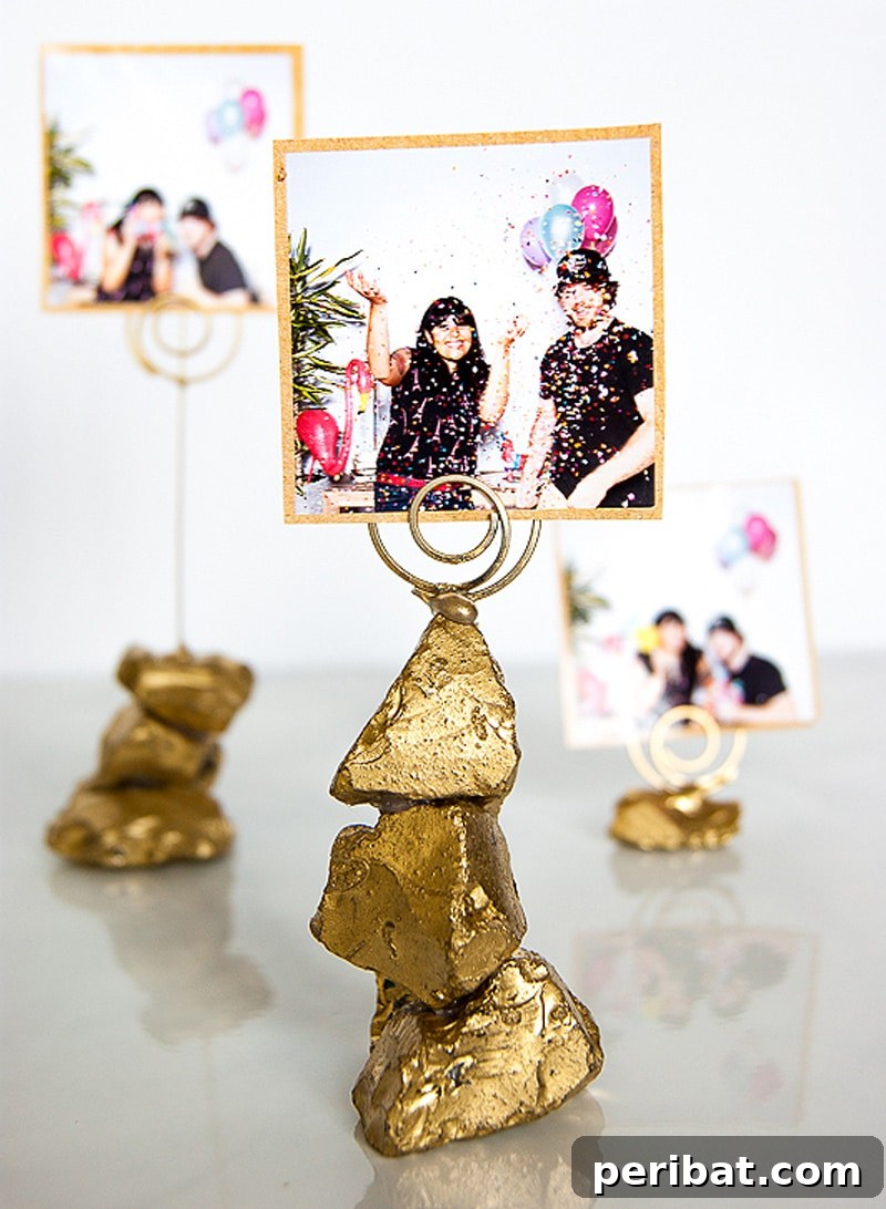 Elegant golden nugget photo holder, crafted from painted glass rocks, serving as a unique party favor.