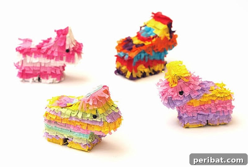 Four miniature pinatas in various shapes, colorful and fun DIY party favors.