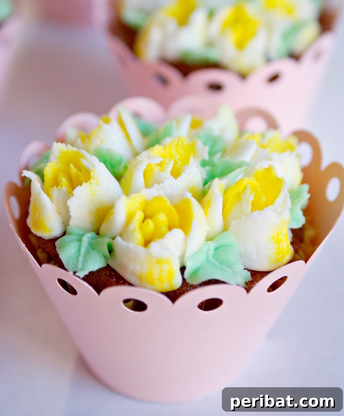 Beautiful cupcake bouquets created using Russian piping tips, a stunning and delicious DIY party favor.