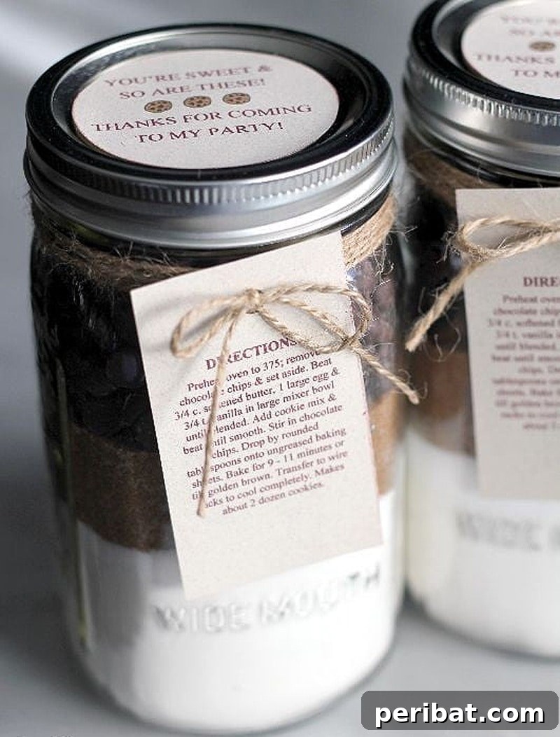 Mason jar filled with pre-measured cookie ingredients for a chocolate chip cookie mix party favor.