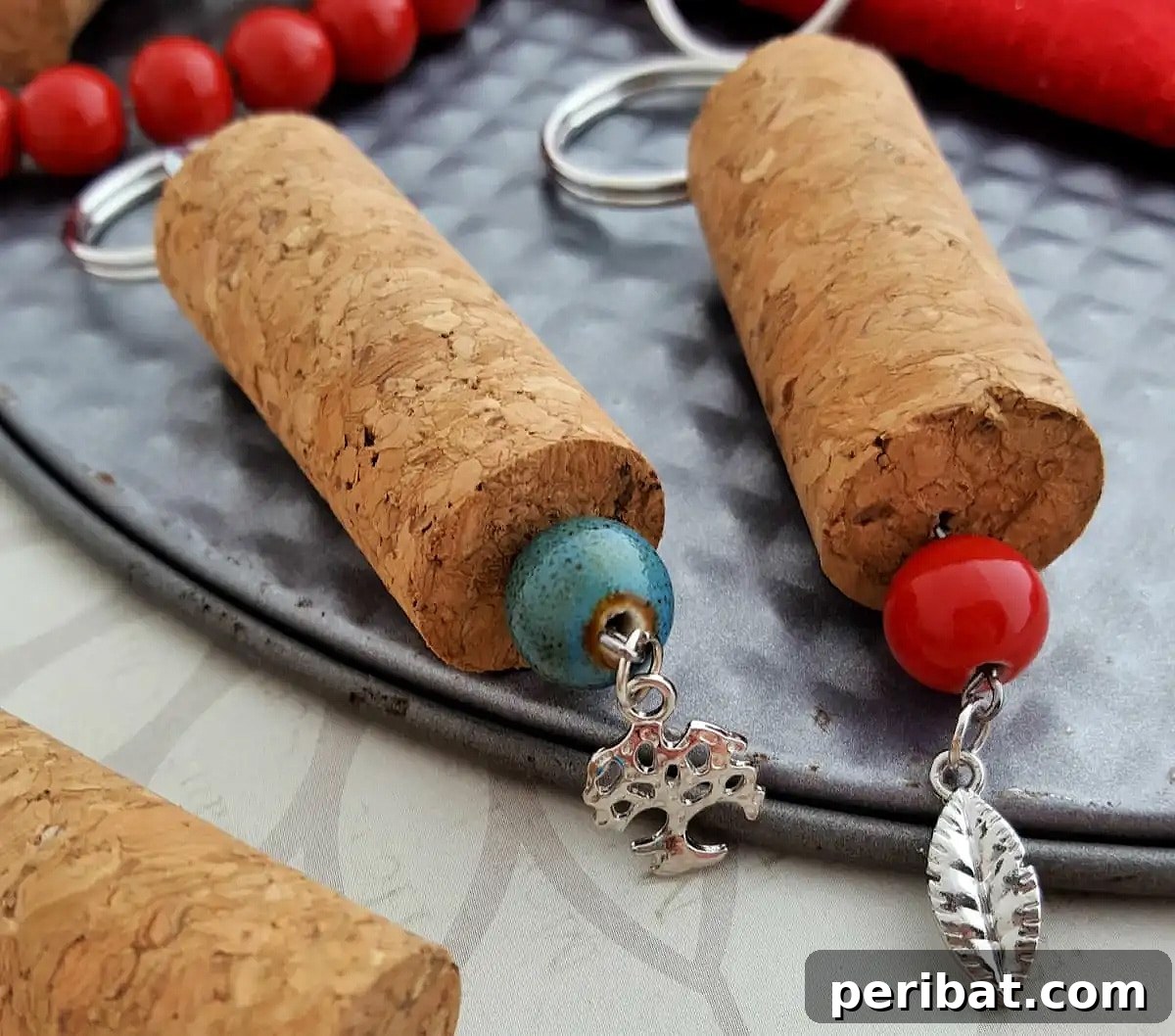 Wine corks transformed into charming keychains, an eco-friendly and creative DIY party favor.