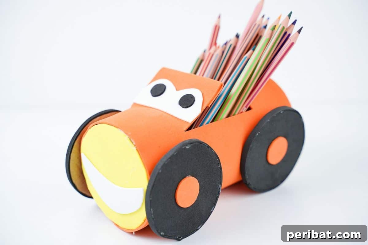 orange plastic bottle pencil holder on white table